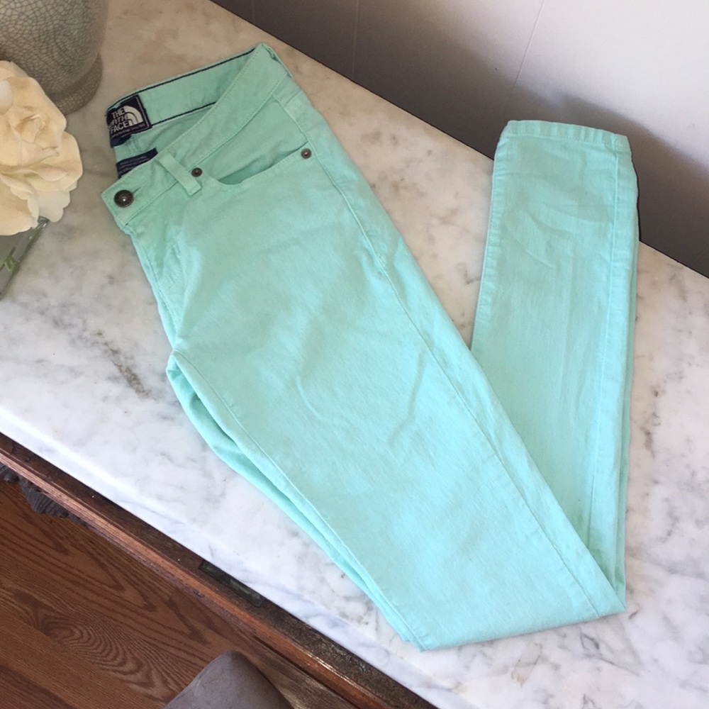 The North Face mint green skinny jeans.